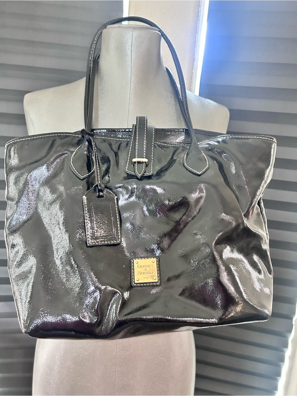 Dooney & Bourke Black Patent Leather Tote with Gold Logo Plaque